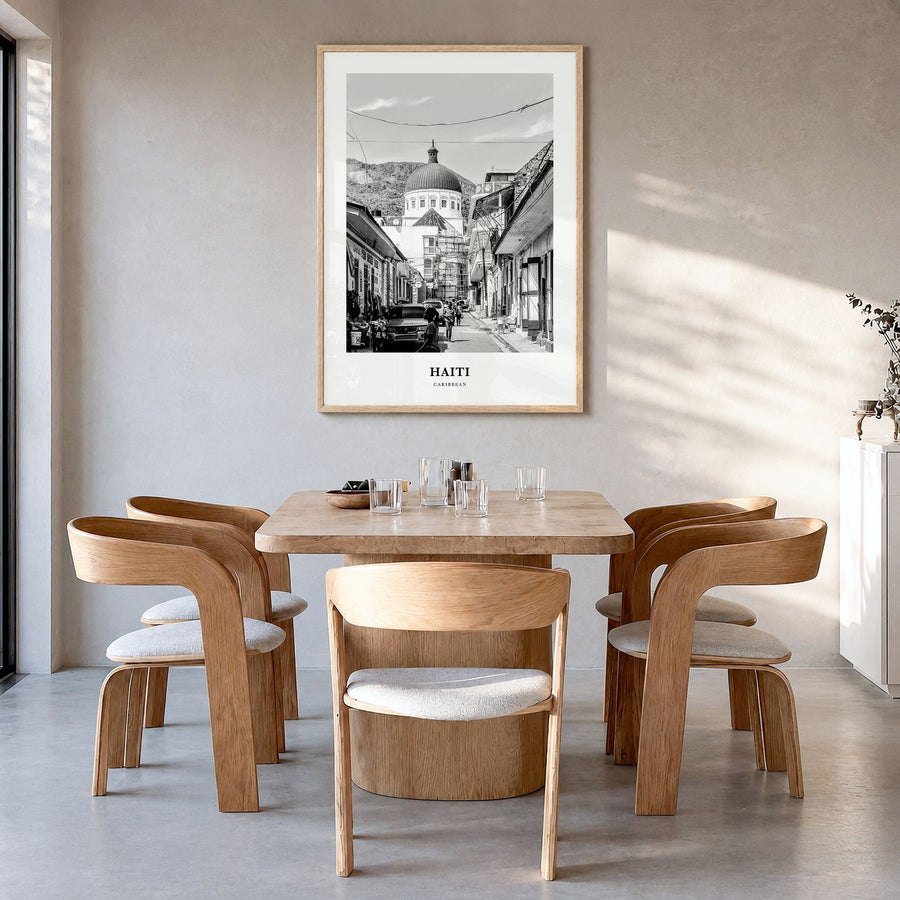 Haiti Classic No 3 Poster in a natural wood frame, hanging in a dining room
