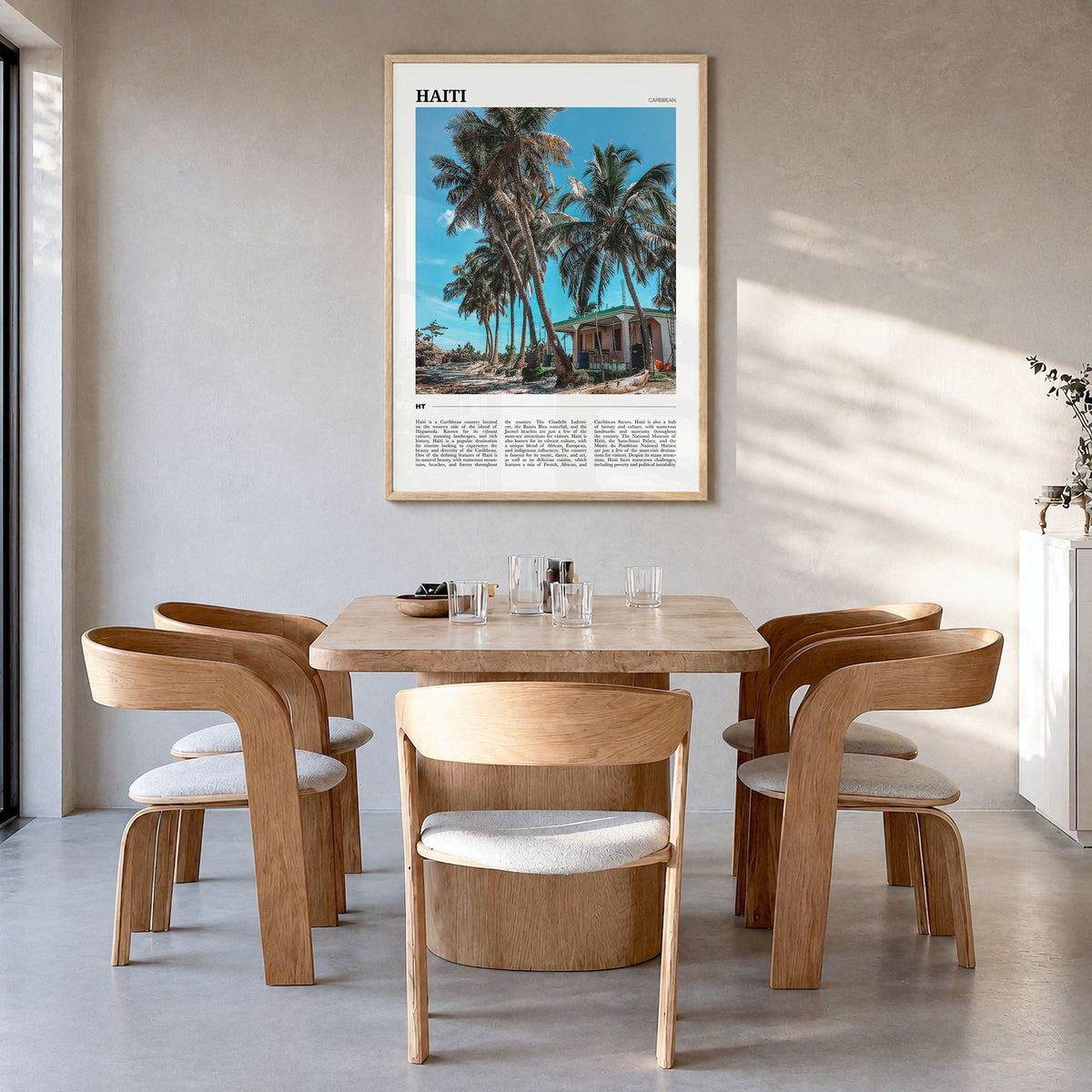 Haiti Travel Poster in a natural wood frame, hanging in a dining room