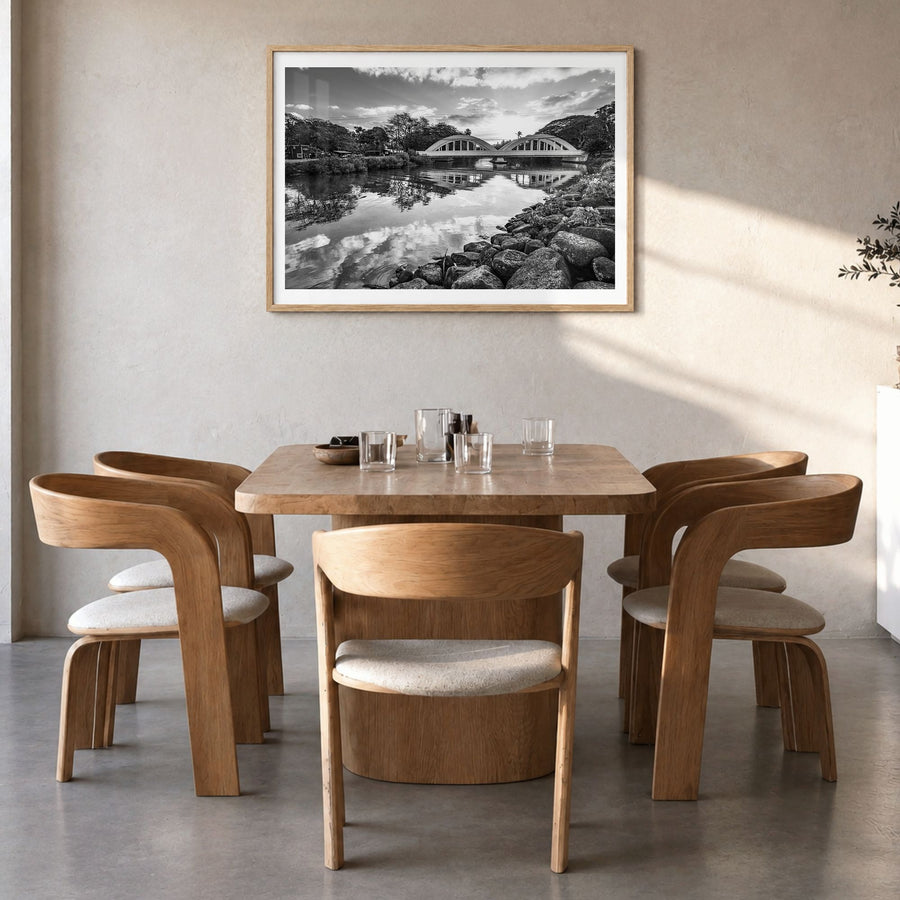 Haleiwa Photo Poster in a natural wood frame, hanging in a dining room, white border