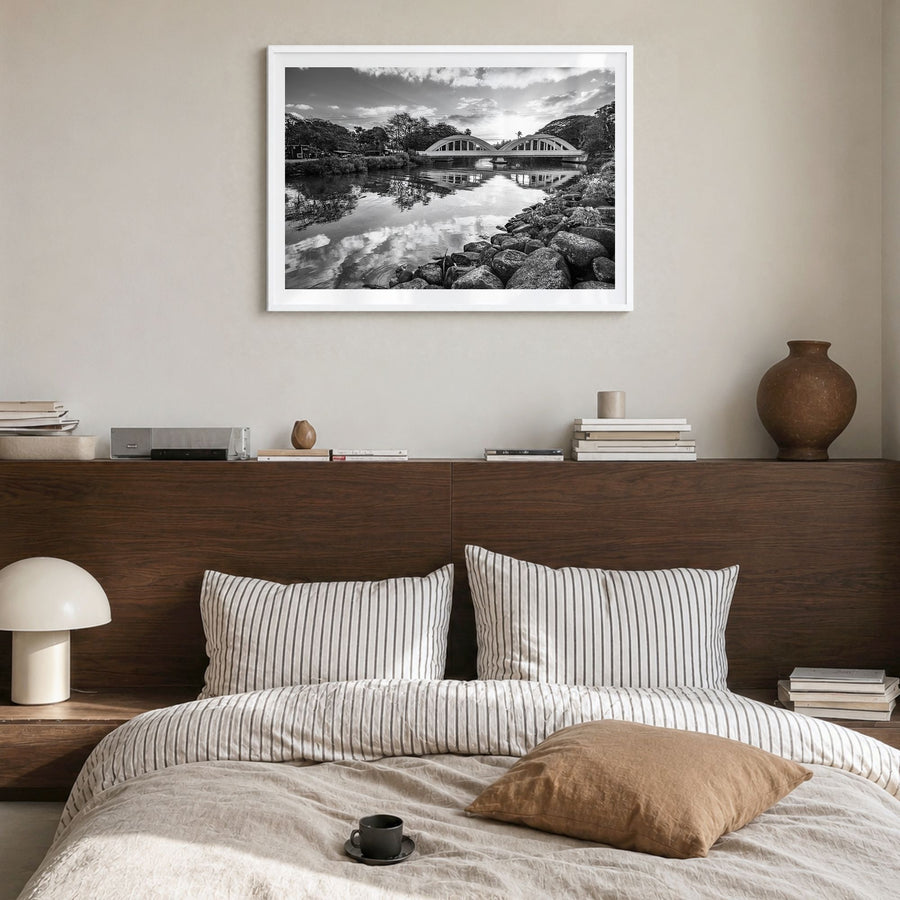 Haleiwa Photo Poster in a white wood frame, hanging in a bedroom, white border