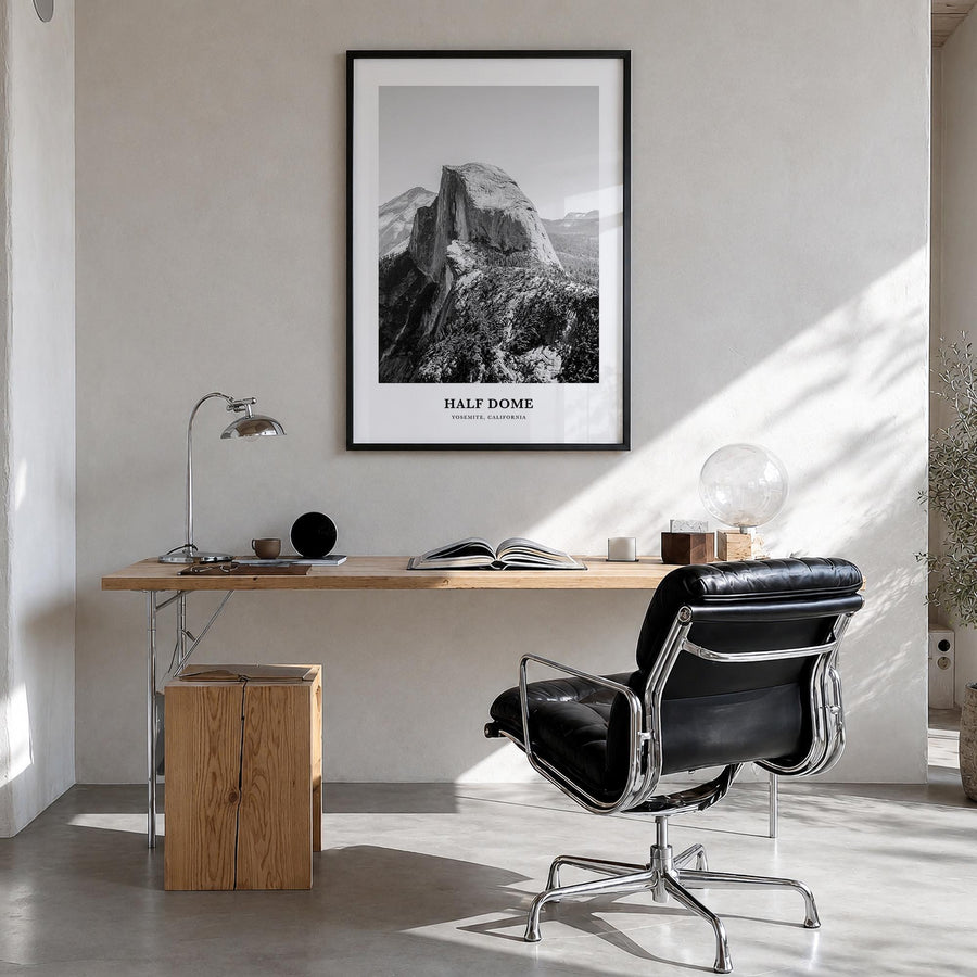 Half Dome black & white classic poster of Yosemite, California – vertical wall art in black wood frame, hanging on wall