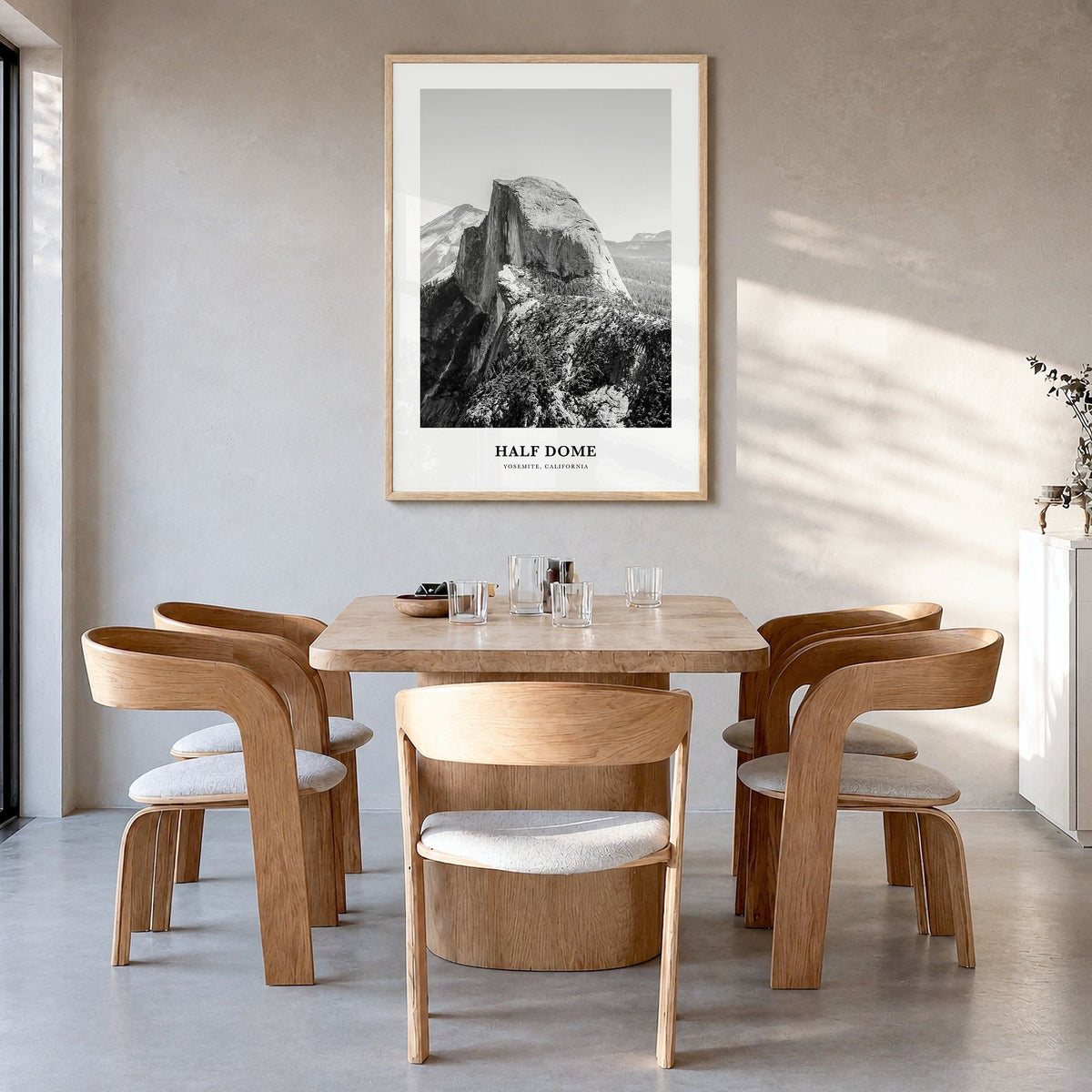 Half Dome Classic Poster in a natural wood frame, hanging in a dining room