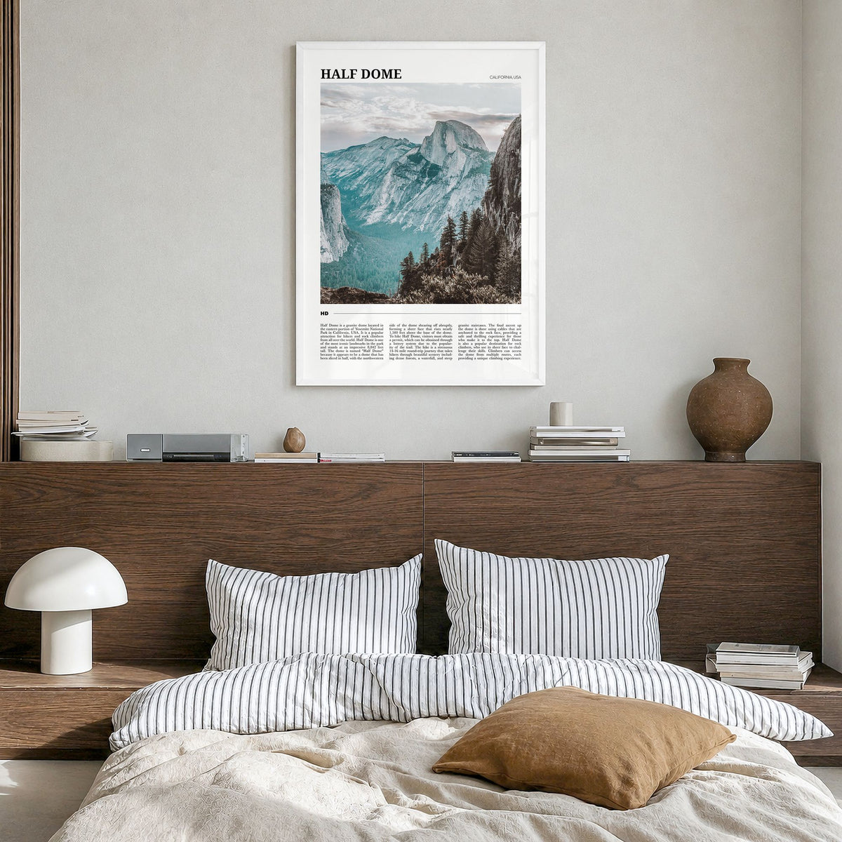 Half Dome Travel Poster in a white wood frame, hanging in a bedroom