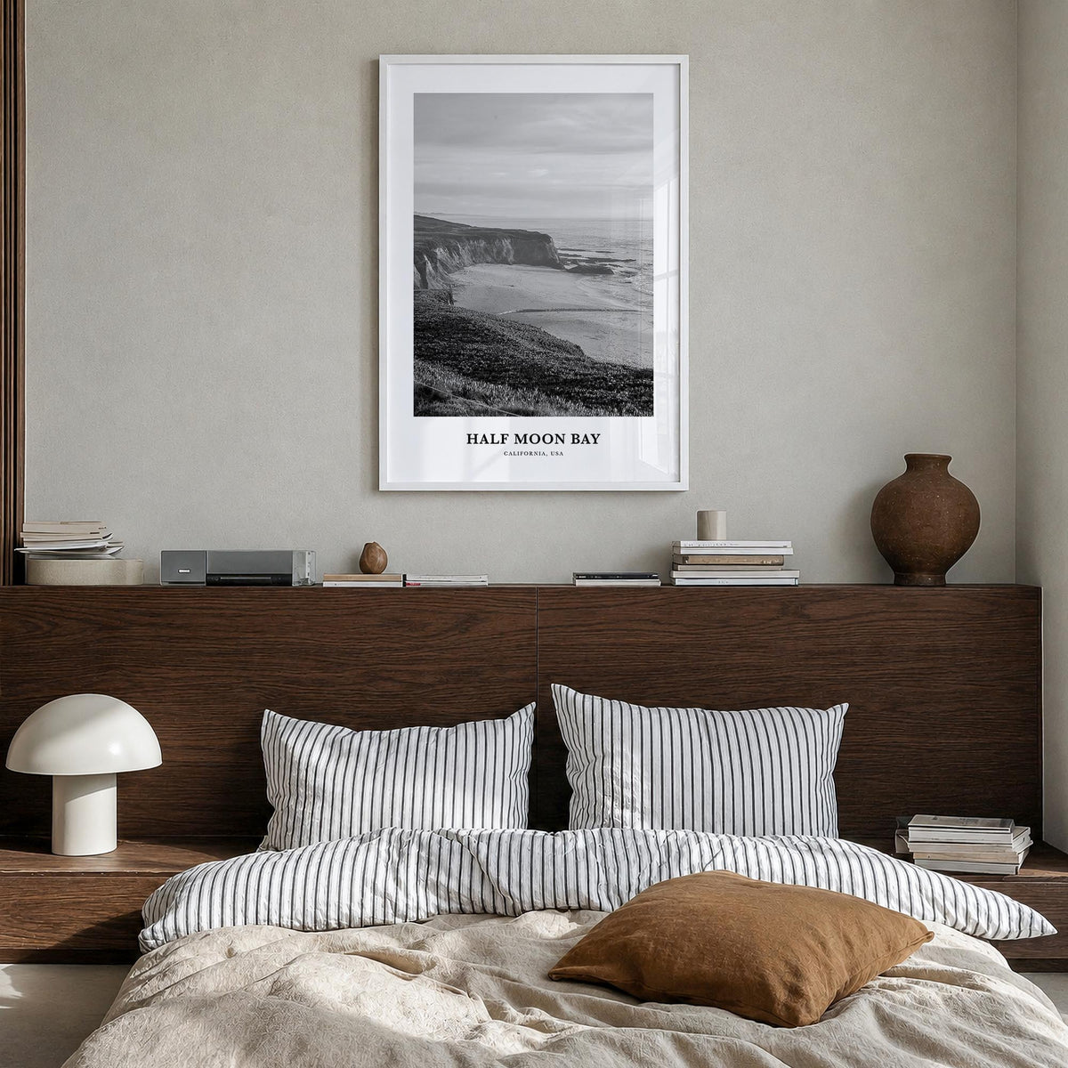 Half Moon Bay black & white classic poster of California, USA – vertical wall art in white wood frame, hanging on wall