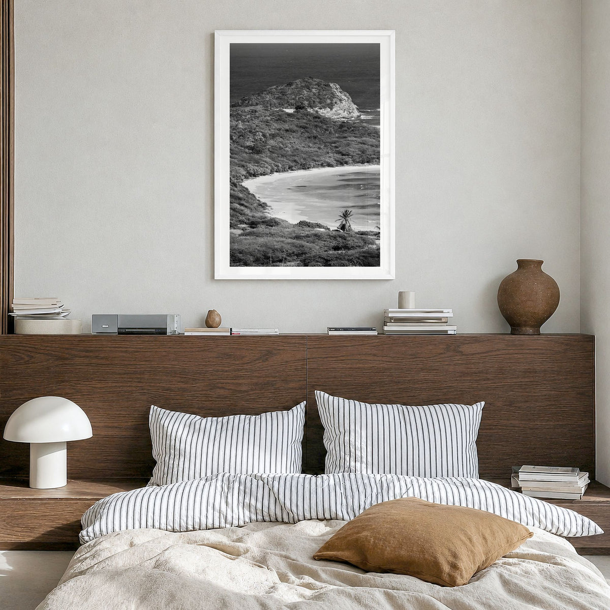 Half Moon Bay Photo Poster in a white wood frame, hanging in a bedroom, white border