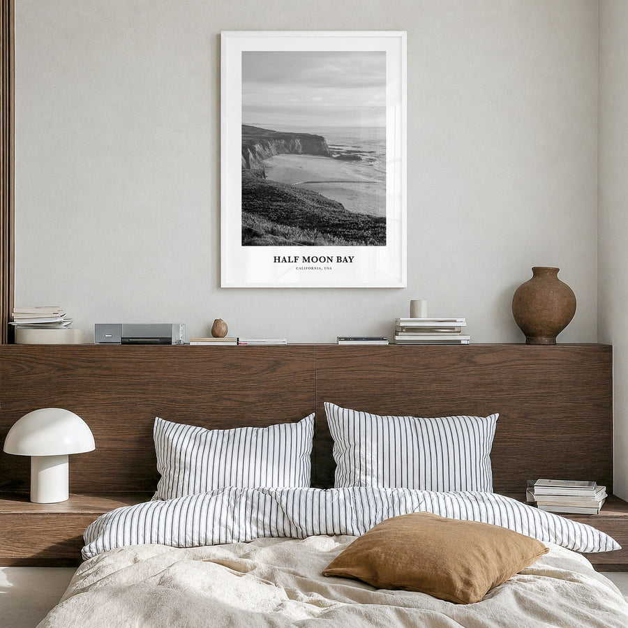 Half Moon Bay Classic Poster in a white wood frame, hanging in a bedroom