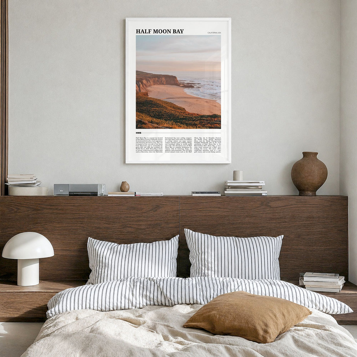 Half Moon Bay Travel No 1 Poster in a white wood frame, hanging in a bedroom
