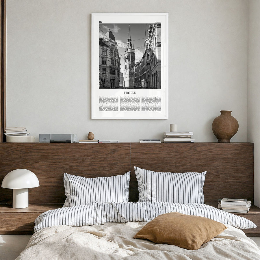 Halle Newspaper Poster in a white wood frame, hanging in a bedroom