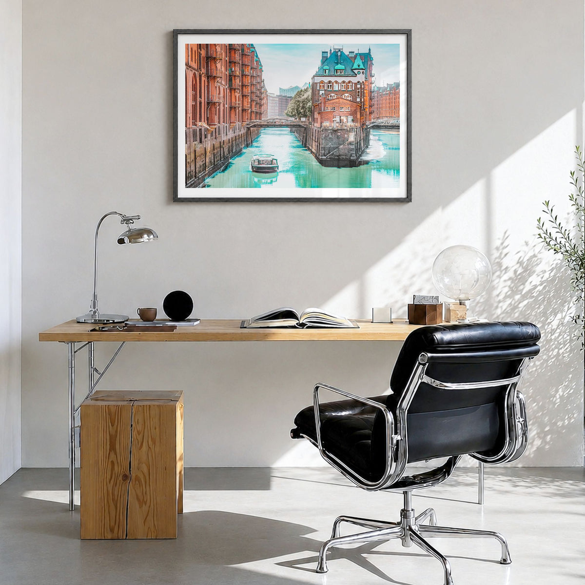 Hamburg Photo Poster in a black wood frame, hanging in a bright home office, white border