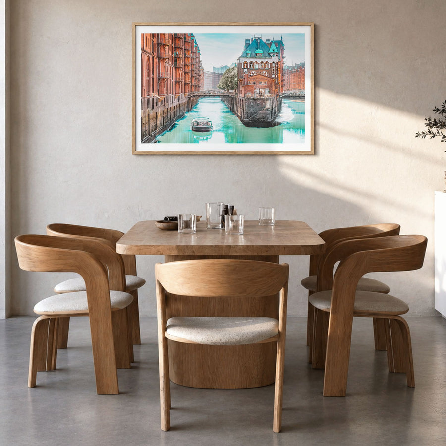 Hamburg Photo Poster in a natural wood frame, hanging in a dining room, white border