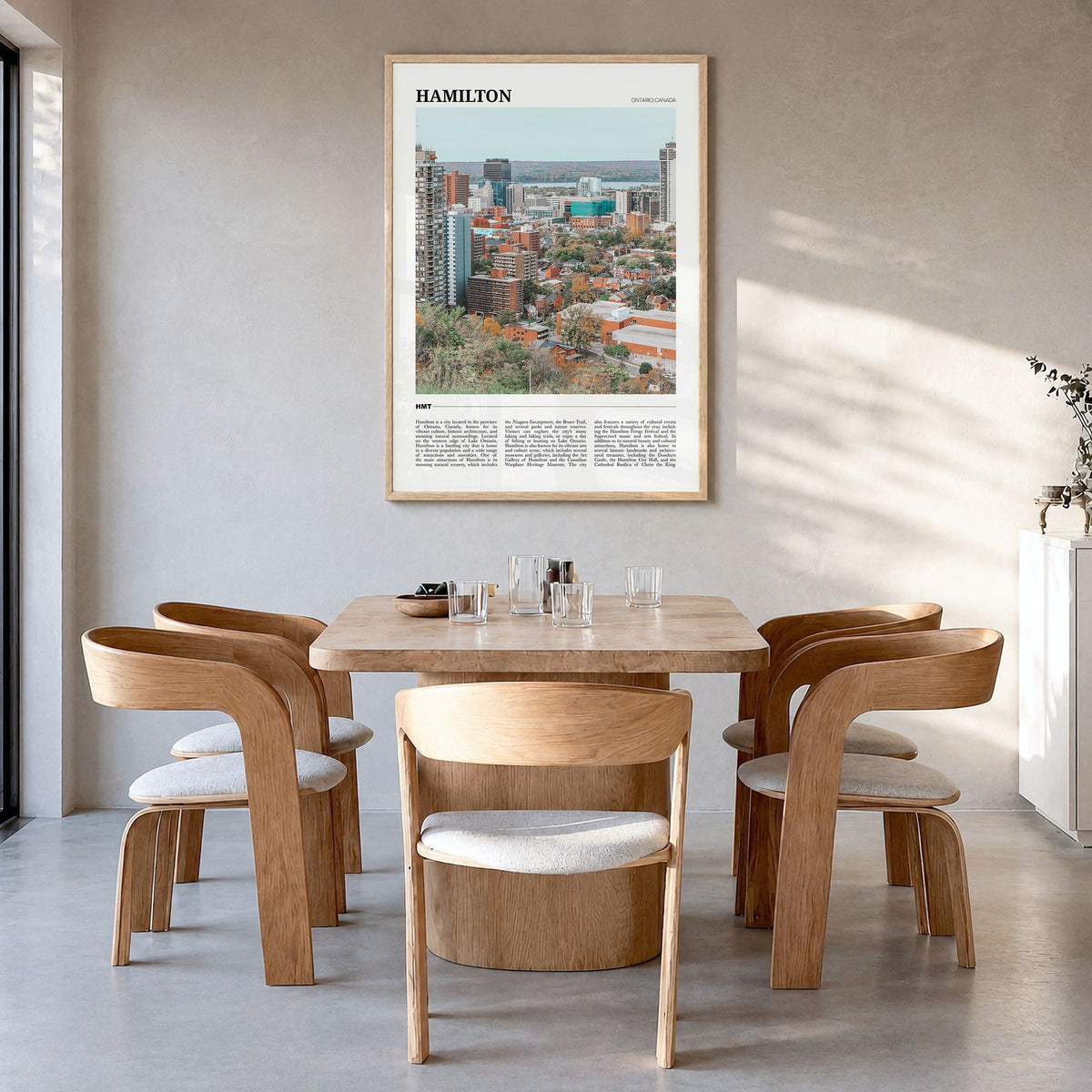Hamilton, Canada Travel Poster in a natural wood frame, hanging in a dining room