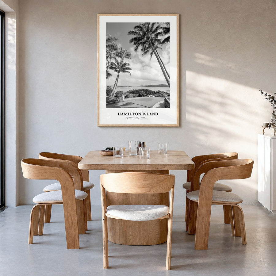 Hamilton Island Classic Poster in a natural wood frame, hanging in a dining room