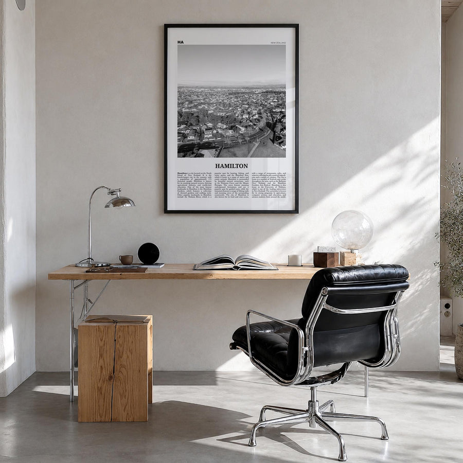 Hamilton, New Zealand black & white newspaper poster of New Zealand – vertical wall art in black wood frame, hanging on wall
