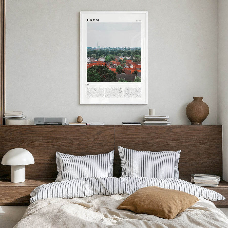 Hamm Travel Poster in a white wood frame, hanging in a bedroom