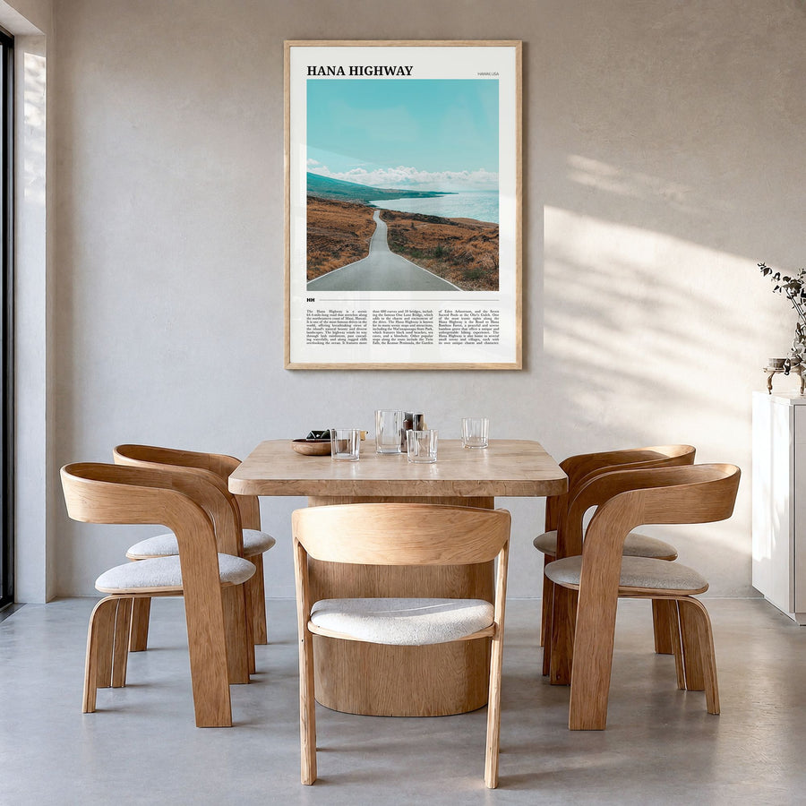 Hana Highway Travel Poster in a natural wood frame, hanging in a dining room
