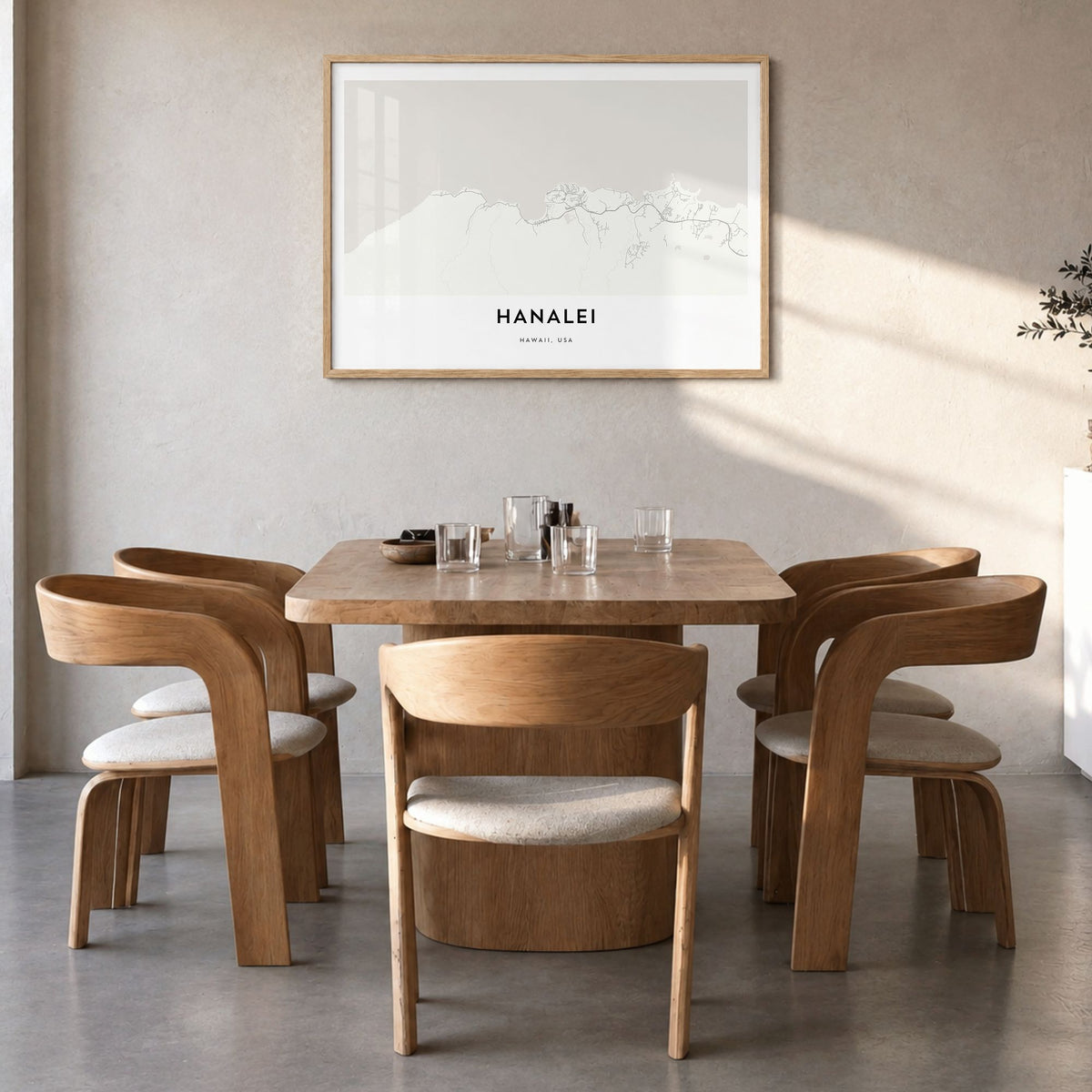 Hanalei Map Poster in a natural wood frame, hanging in a dining room
