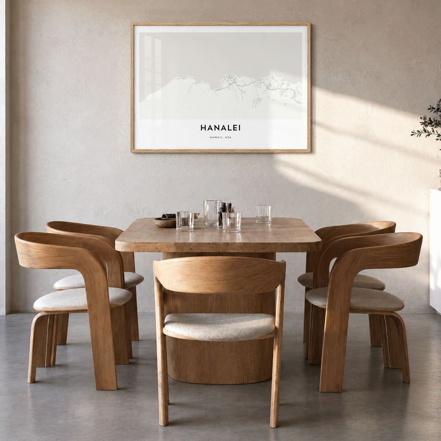 Hanalei Map Poster in a natural wood frame, hanging in a dining room