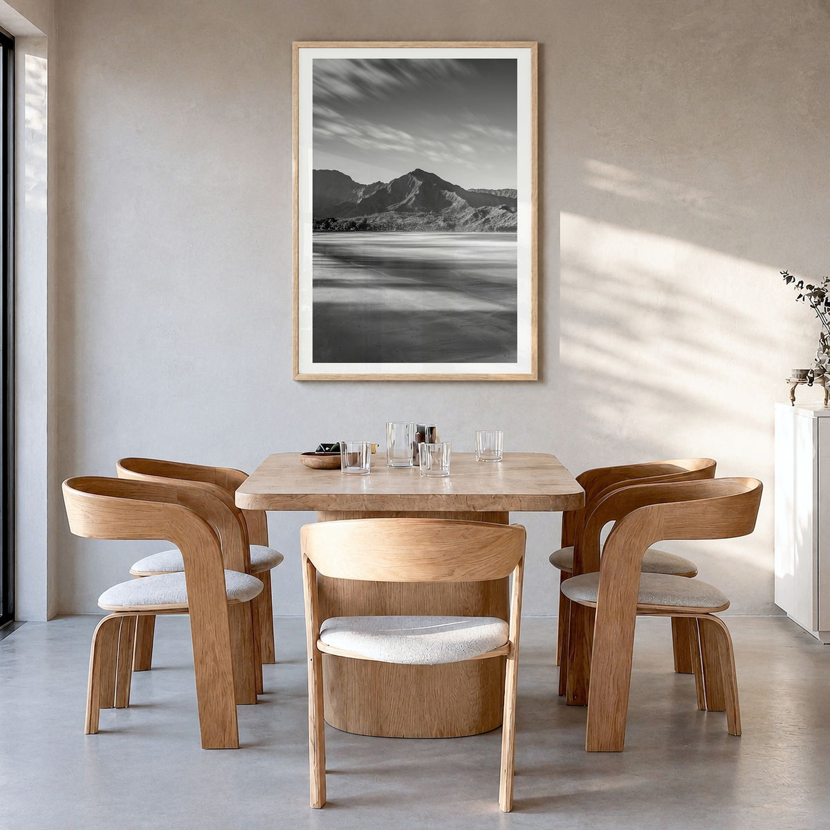 Hanalei Photo Poster in a natural wood frame, hanging in a dining room, white border
