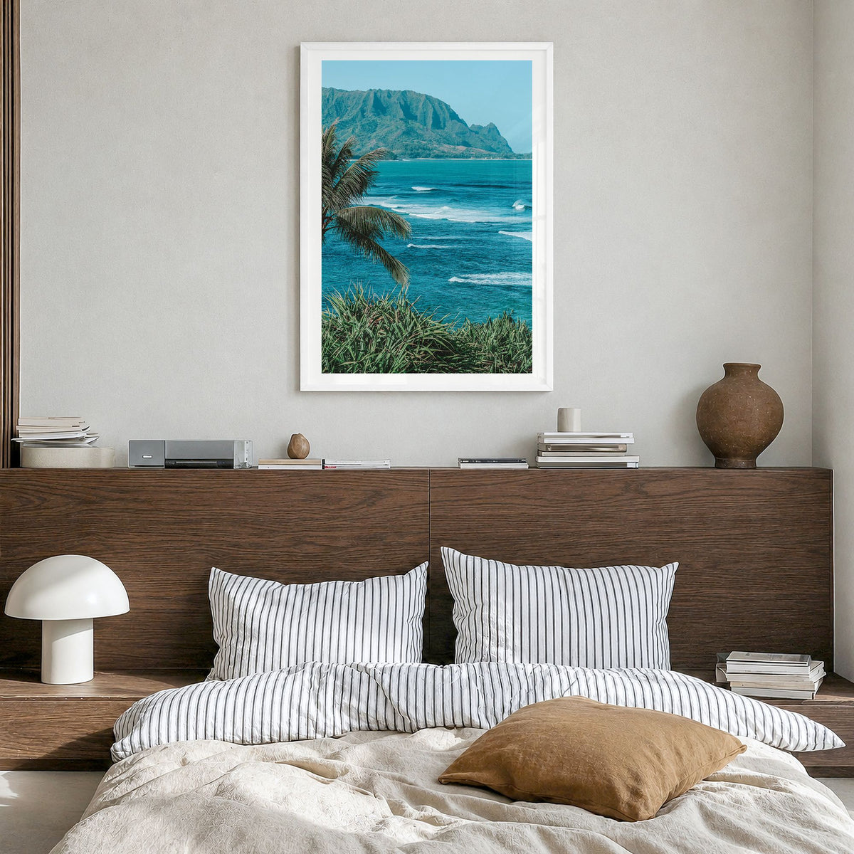 Hanalei Photo Poster in a white wood frame, hanging in a bedroom, white border