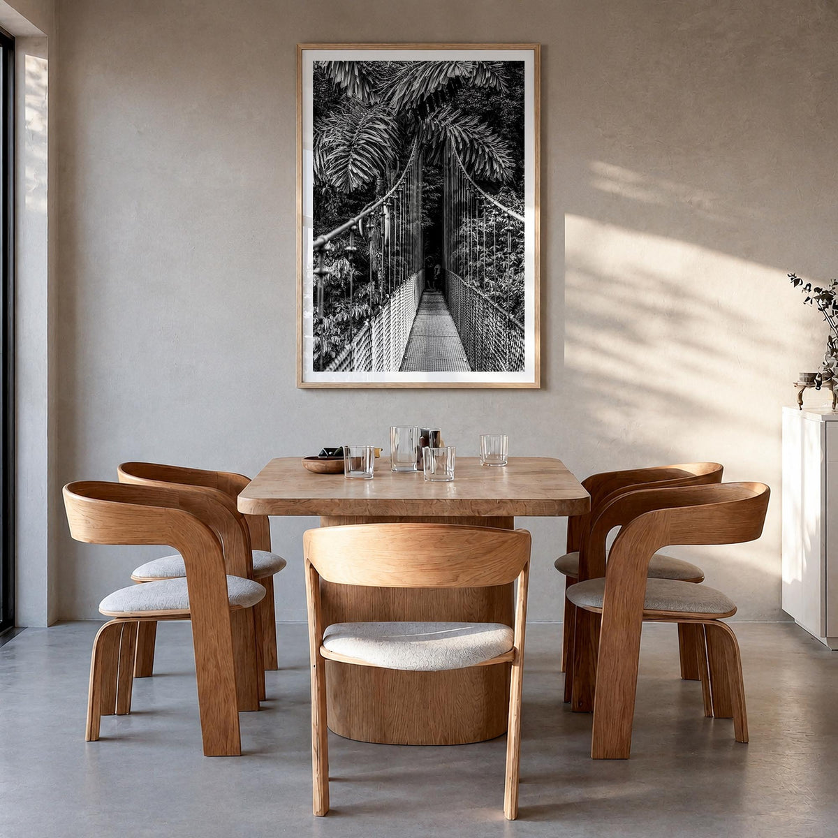 Hanging Bridge black & white photo poster – vertical wall art in natural wood frame with white border, hanging on wall