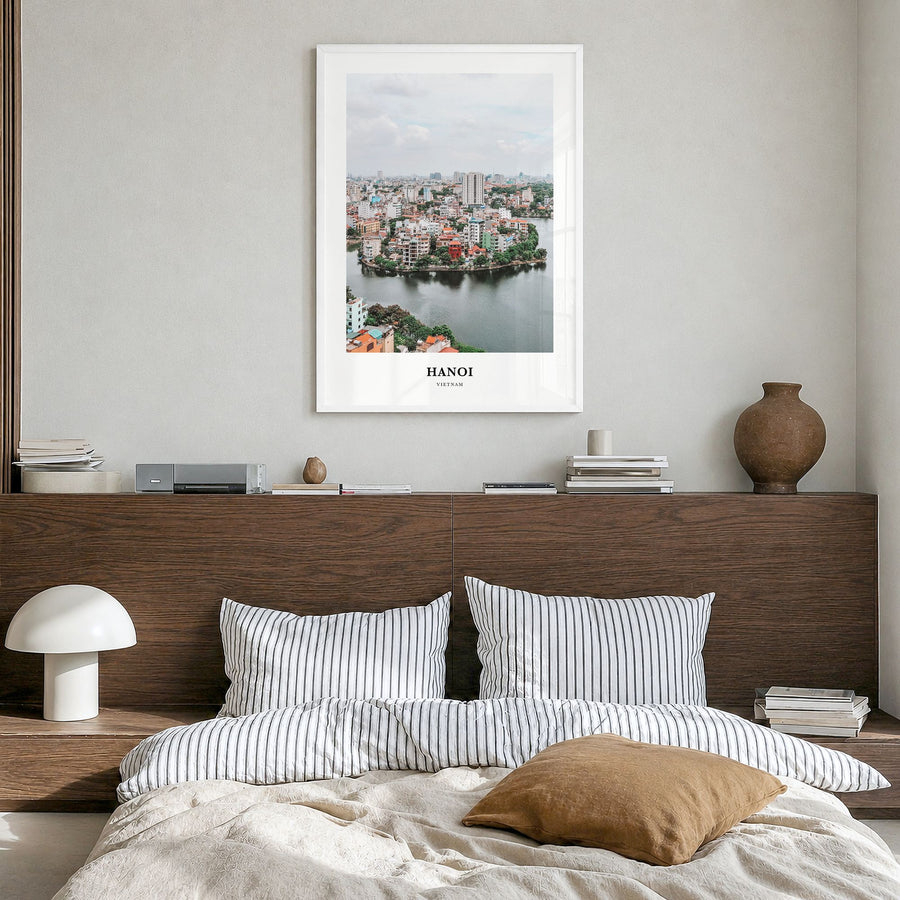 Hanoi Classic Poster in a white wood frame, hanging in a bedroom