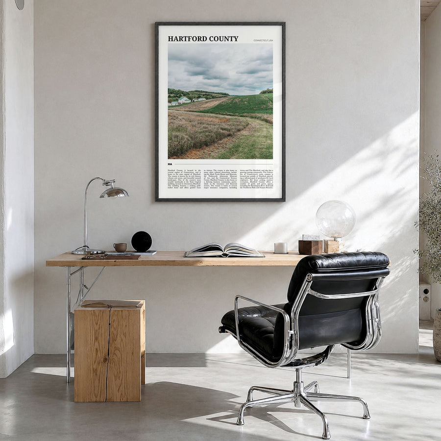 Hartford County Travel Poster in a black wood frame, hanging in a bright home office