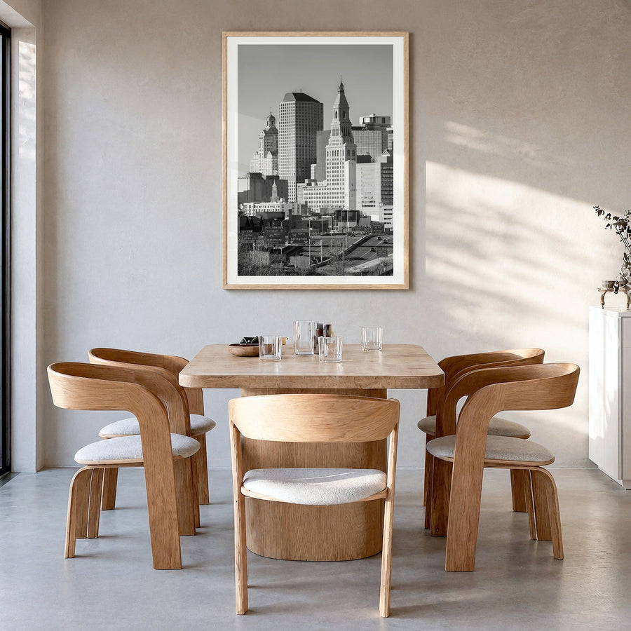 Hartford Photo Poster in a natural wood frame, hanging in a dining room, white border