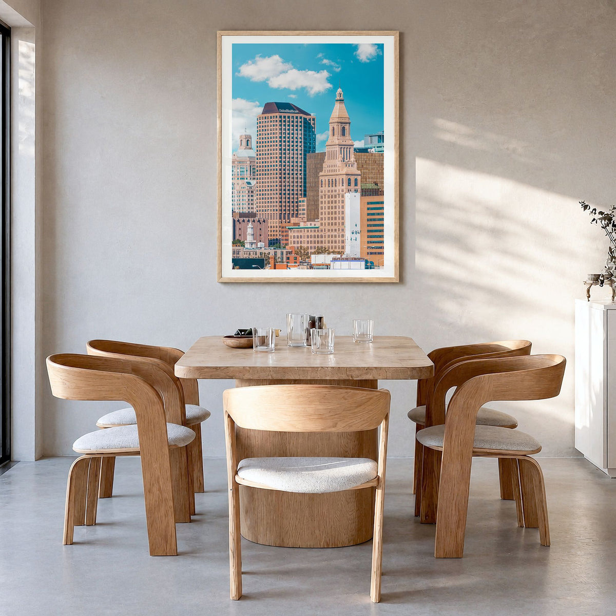 Hartford Photo Poster in a natural wood frame, hanging in a dining room, white border