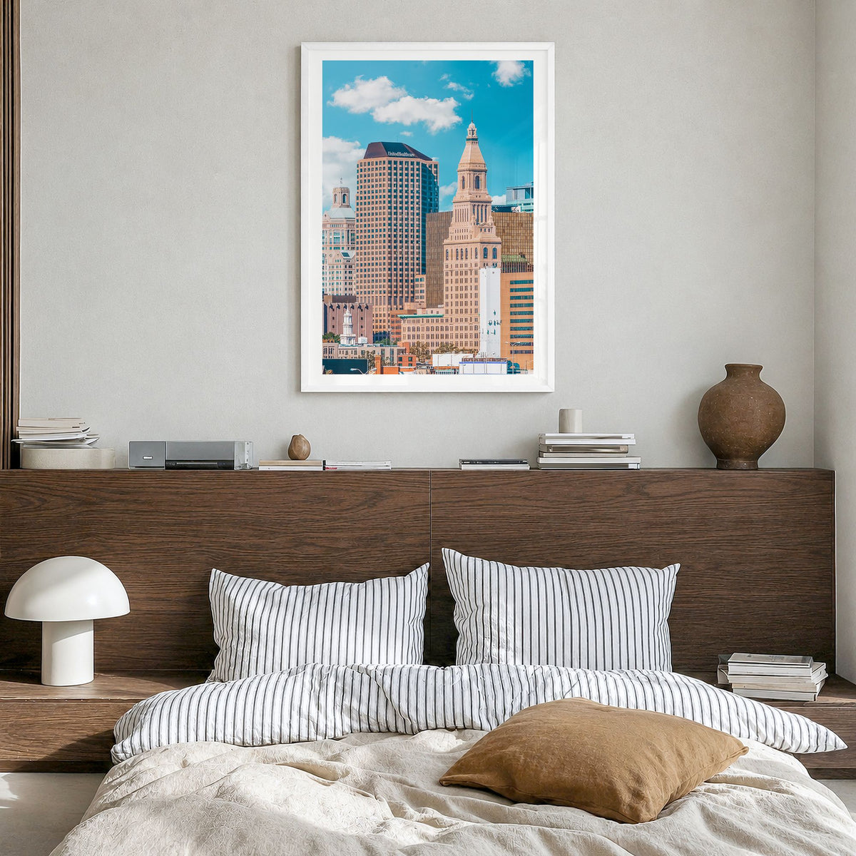 Hartford Photo Poster in a white wood frame, hanging in a bedroom, white border