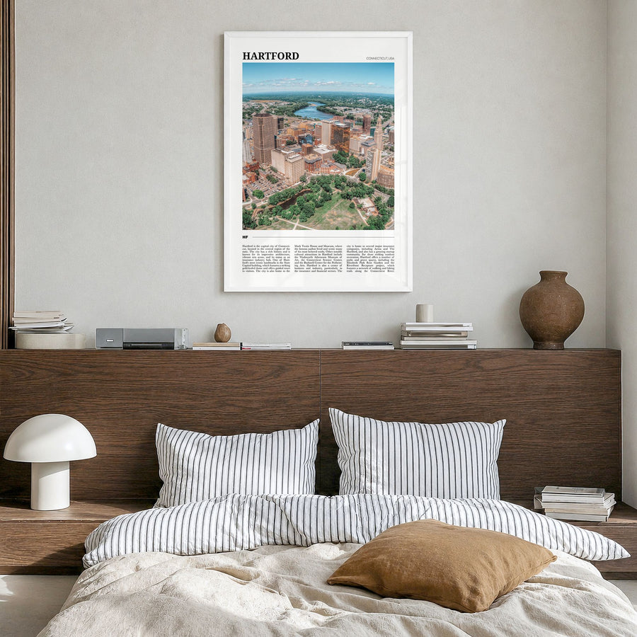 Hartford Travel No 1 Poster in a white wood frame, hanging in a bedroom