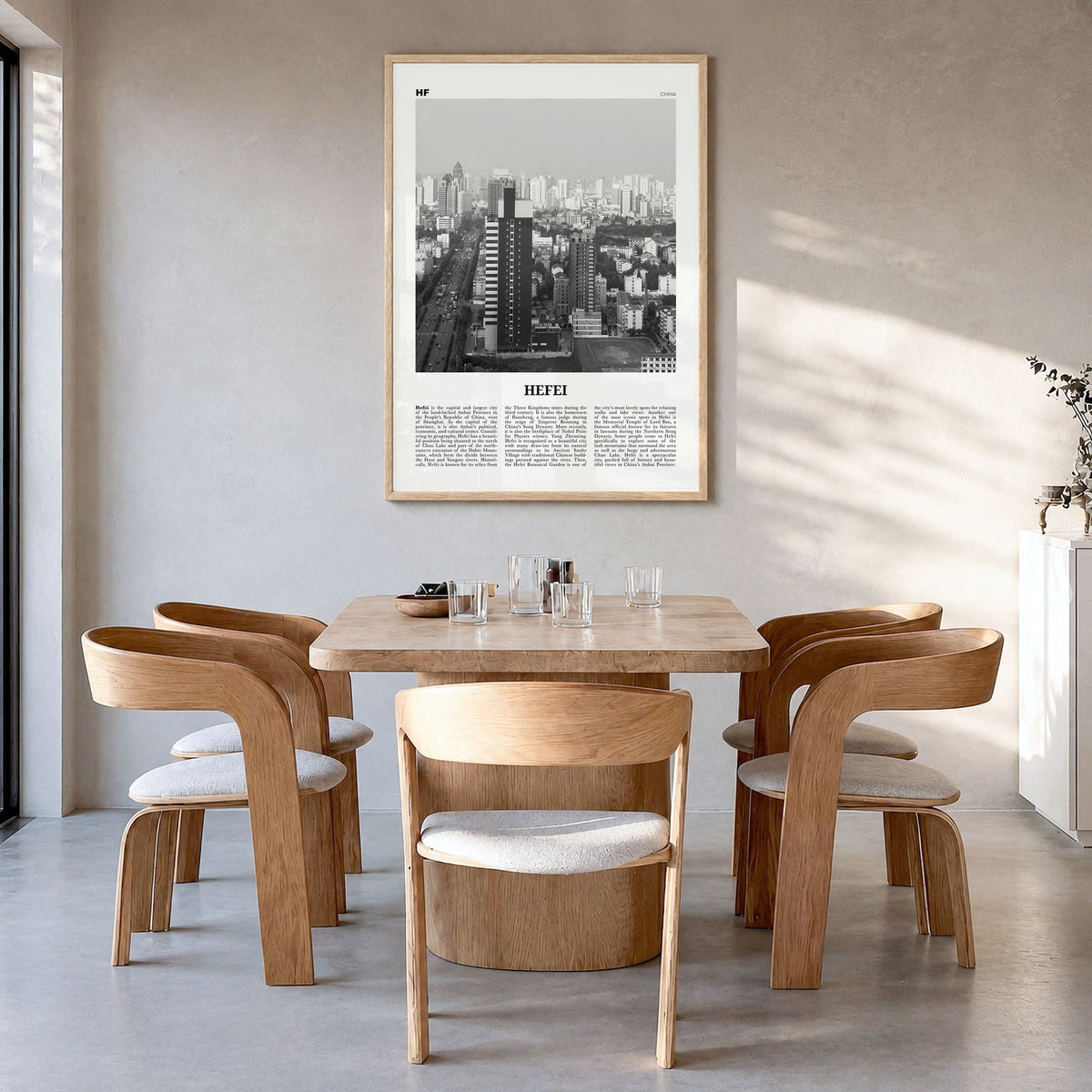Hefei Newspaper Poster in a natural wood frame, hanging in a dining room