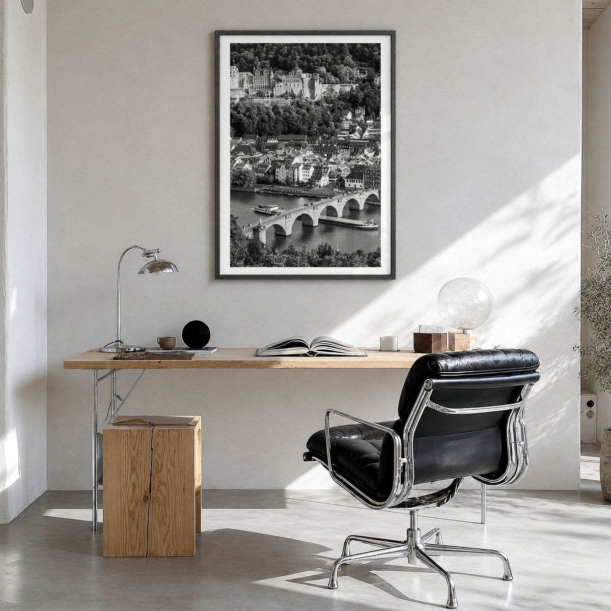Heidelberg Photo Poster in a black wood frame, hanging in a bright home office, white border