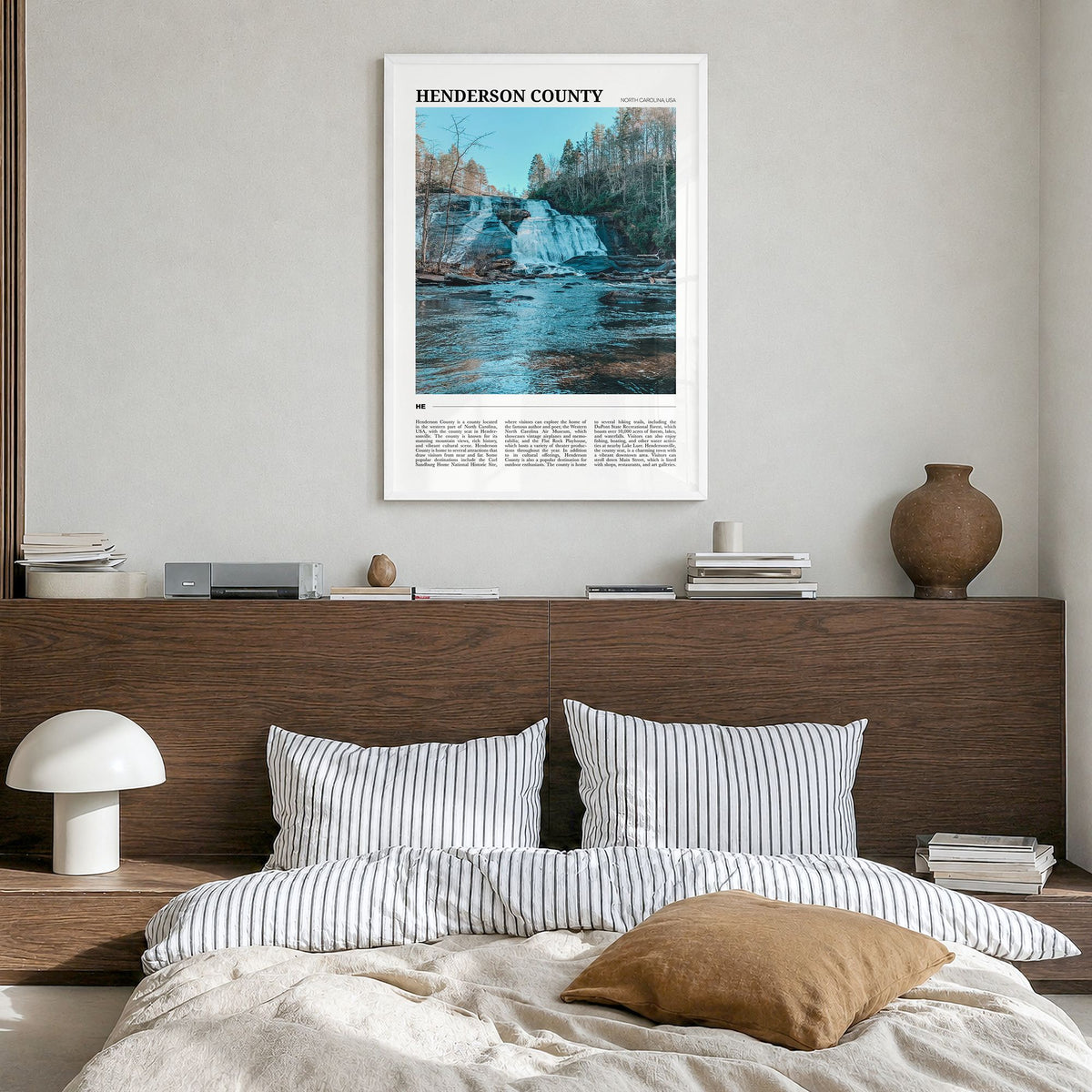 Henderson County, North Carolina Travel Poster in a white wood frame, hanging in a bedroom