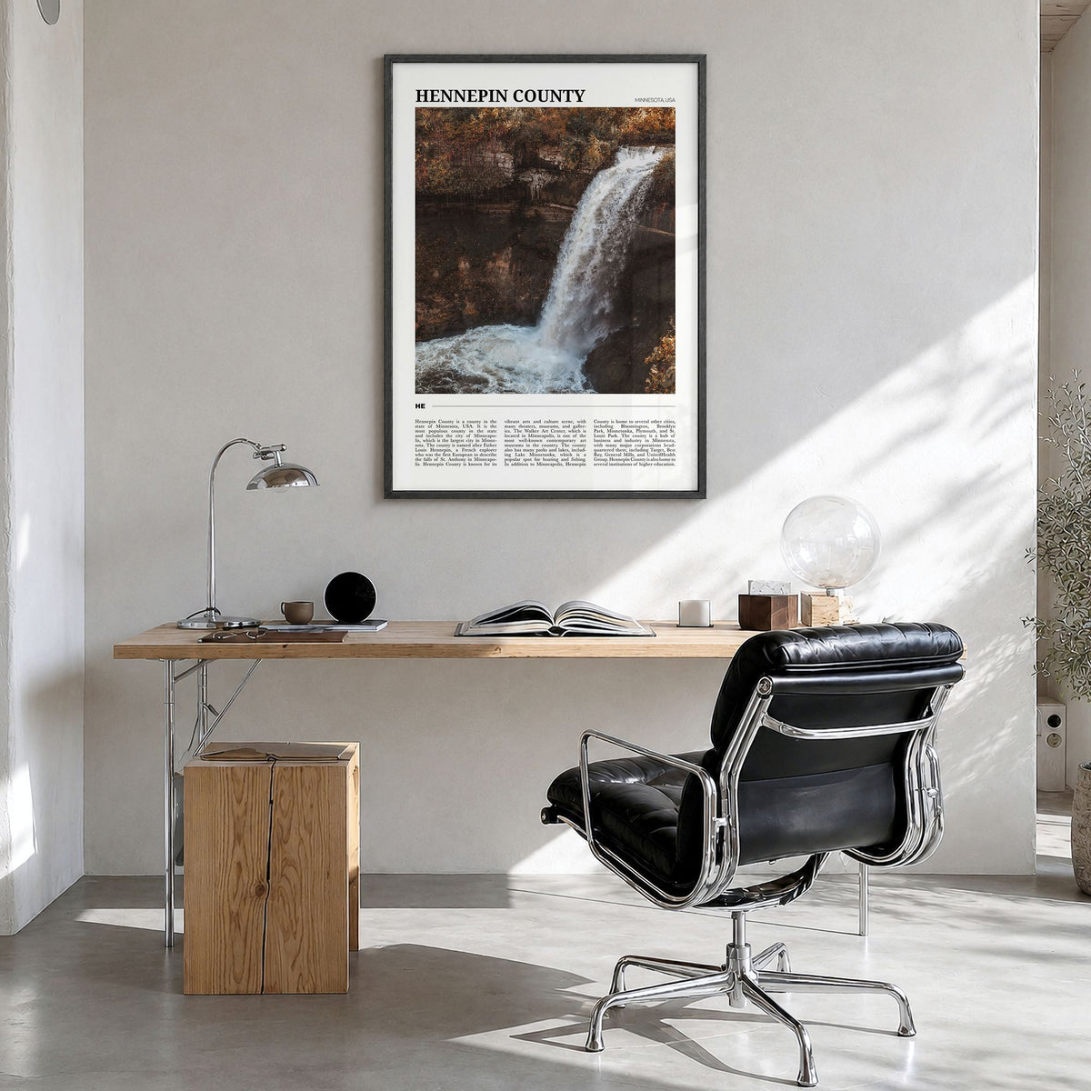 Hennepin County Travel Poster in a black wood frame, hanging in a bright home office
