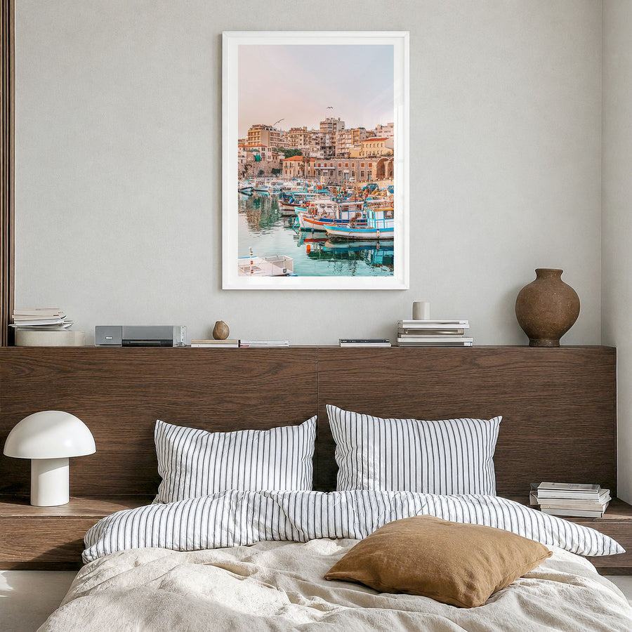 Heraklion Photo Poster in a white wood frame, hanging in a bedroom, white border