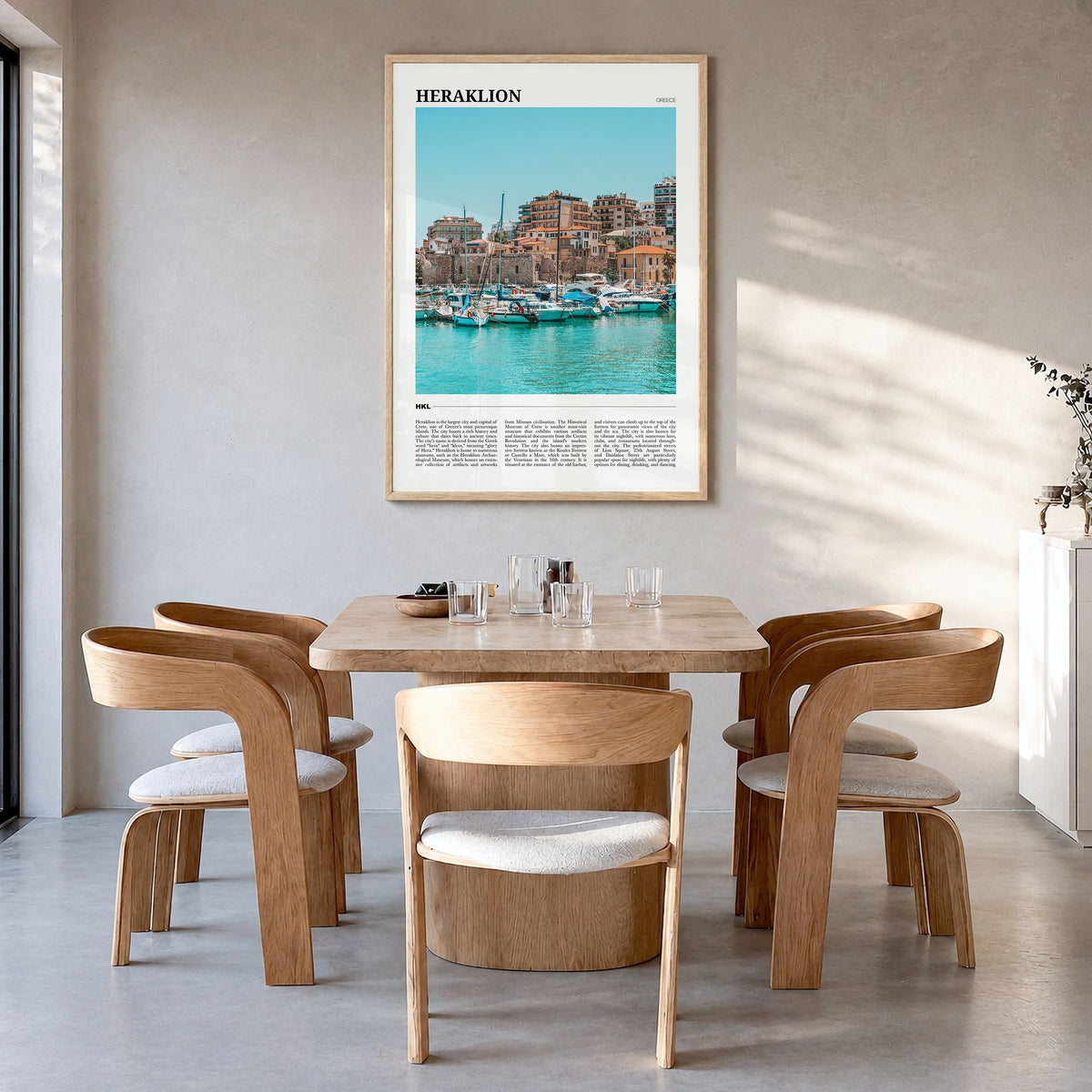 Heraklion Travel Poster in a natural wood frame, hanging in a dining room