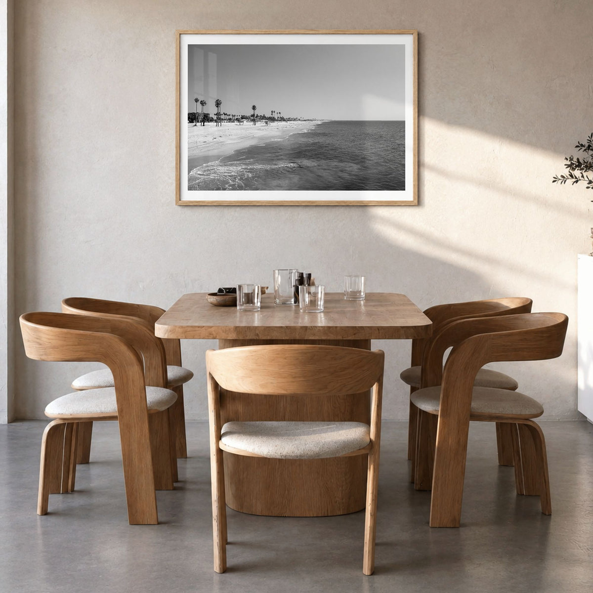 Hermosa Beach Photo Poster in a natural wood frame, hanging in a dining room, white border