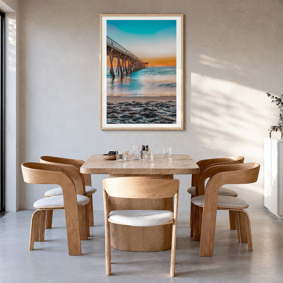 Hermosa Beach Photo No 1 Poster in a natural wood frame, hanging in a dining room, white border