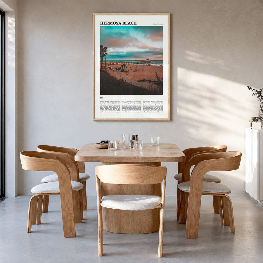 Hermosa Beach Travel Poster in a natural wood frame, hanging in a dining room