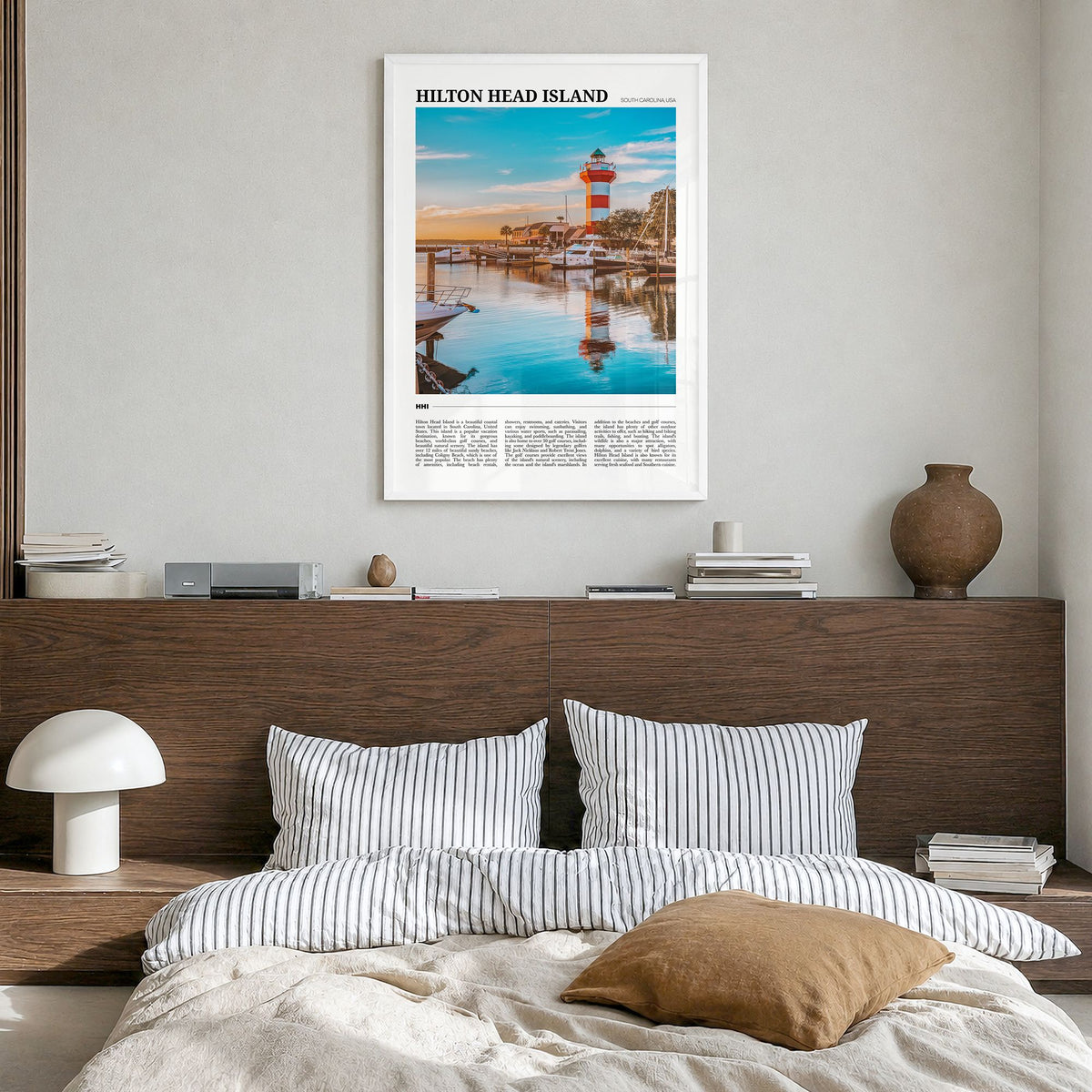 Hilton Head Island Travel Poster in a white wood frame, hanging in a bedroom