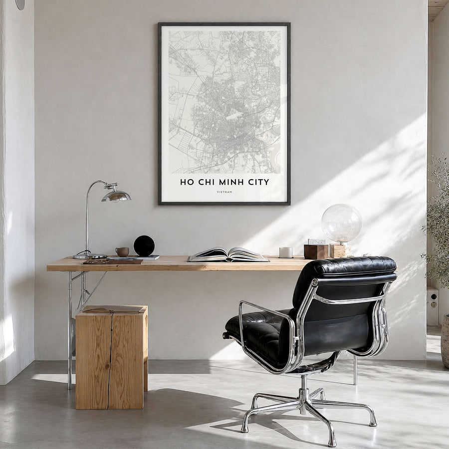 Ho Chi Minh City Map Poster in a black wood frame, hanging in a bright home office