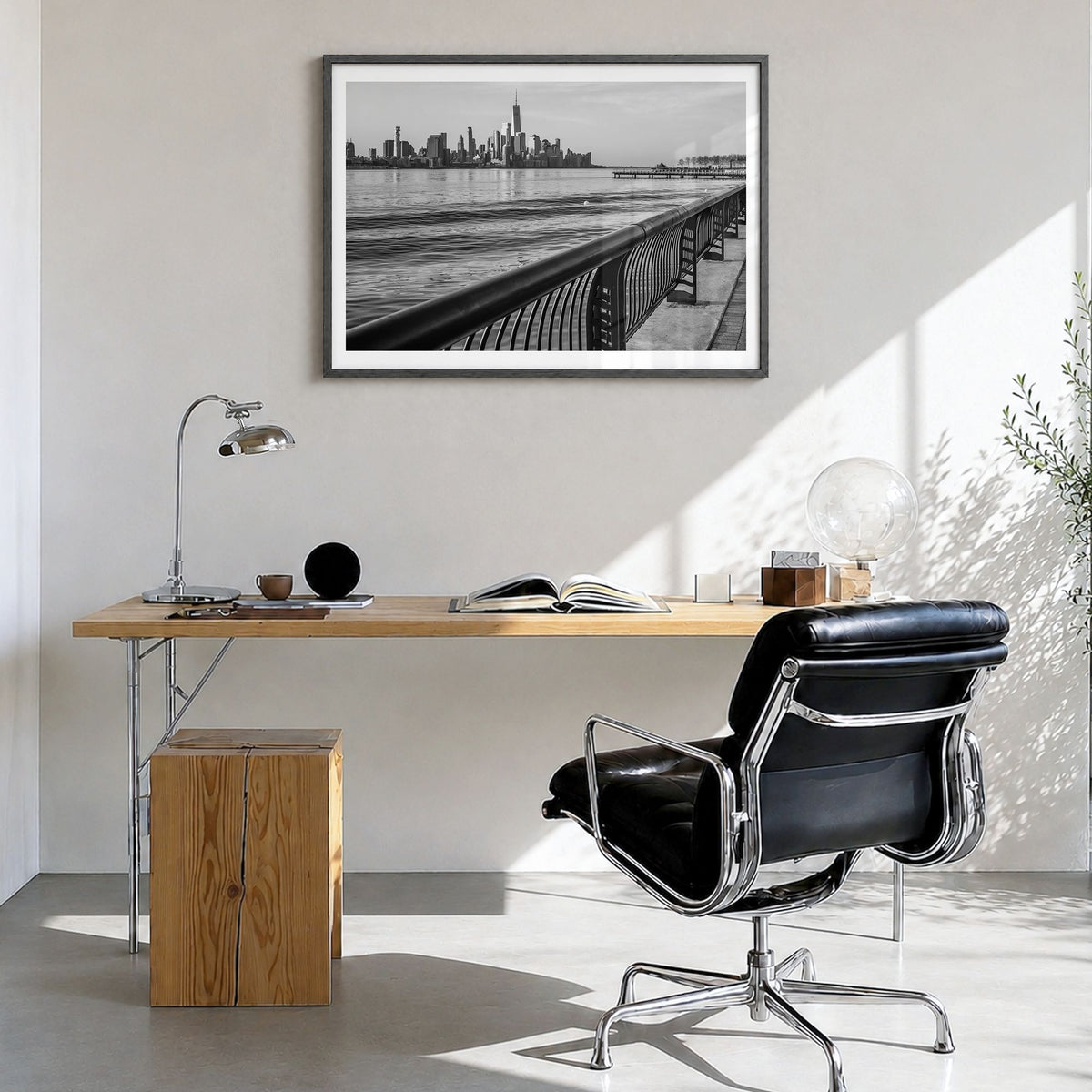 Hoboken Photo Poster in a black wood frame, hanging in a bright home office, white border