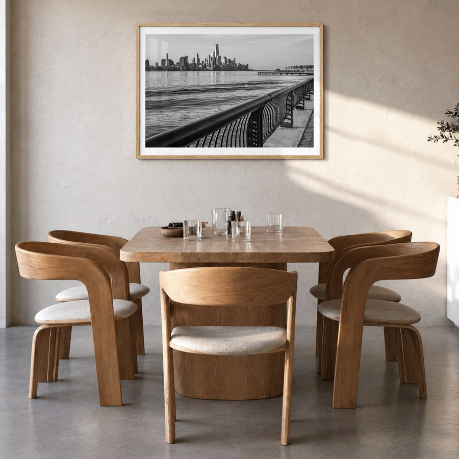 Hoboken Photo Poster in a natural wood frame, hanging in a dining room, white border