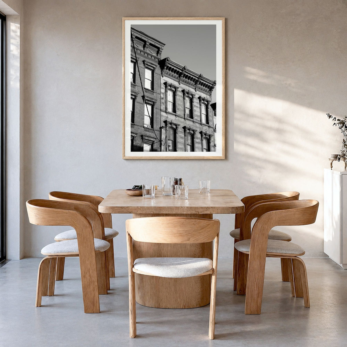 Hoboken Photo Poster in a natural wood frame, hanging in a dining room, white border
