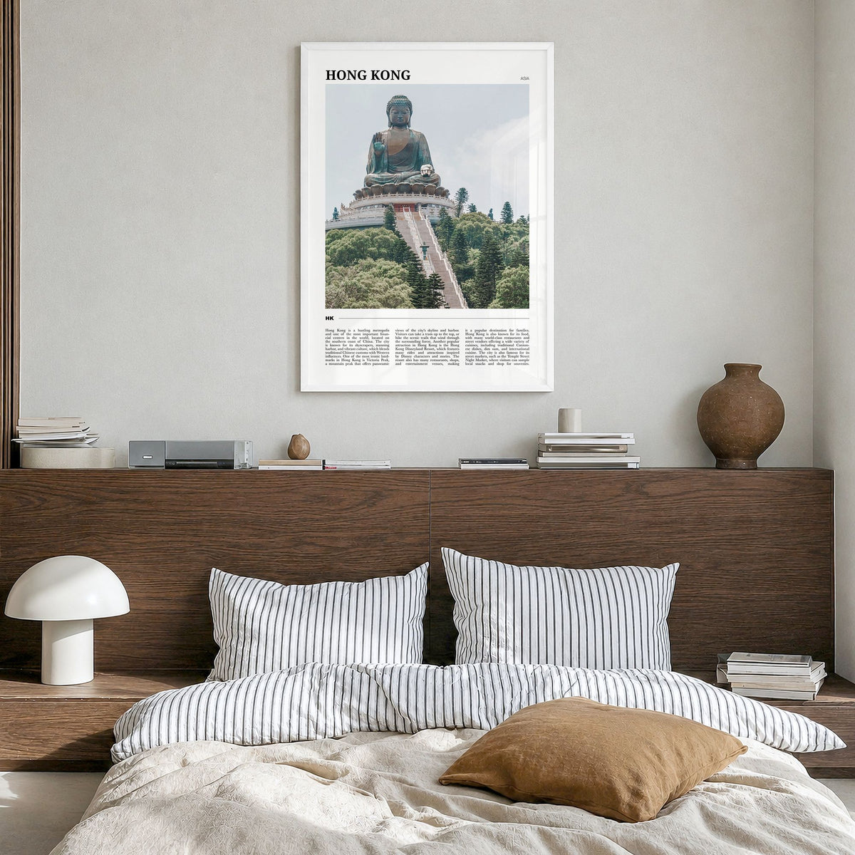 Hong Kong Travel Poster in a white wood frame, hanging in a bedroom