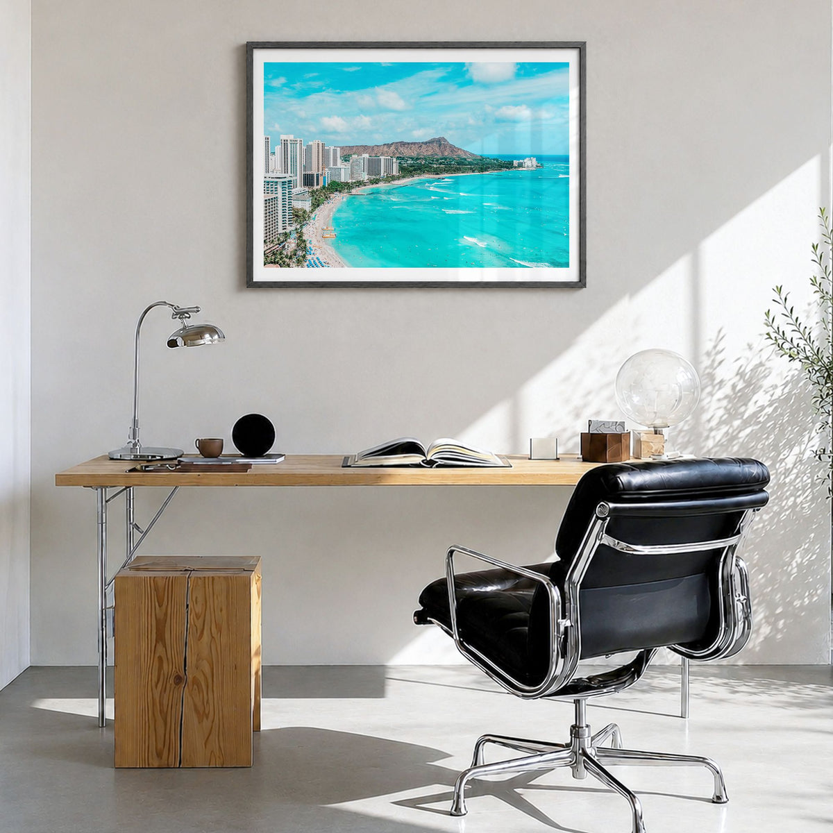 Honolulu Photo Poster in a black wood frame, hanging in a bright home office, white border