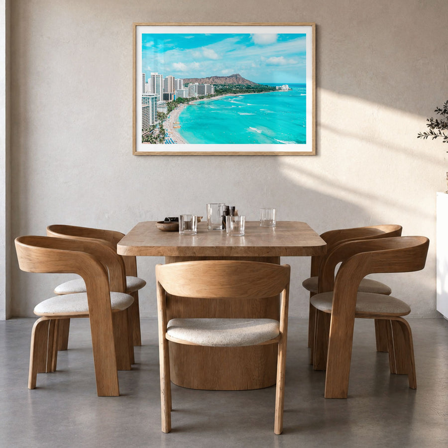 Honolulu Photo Poster in a natural wood frame, hanging in a dining room, white border