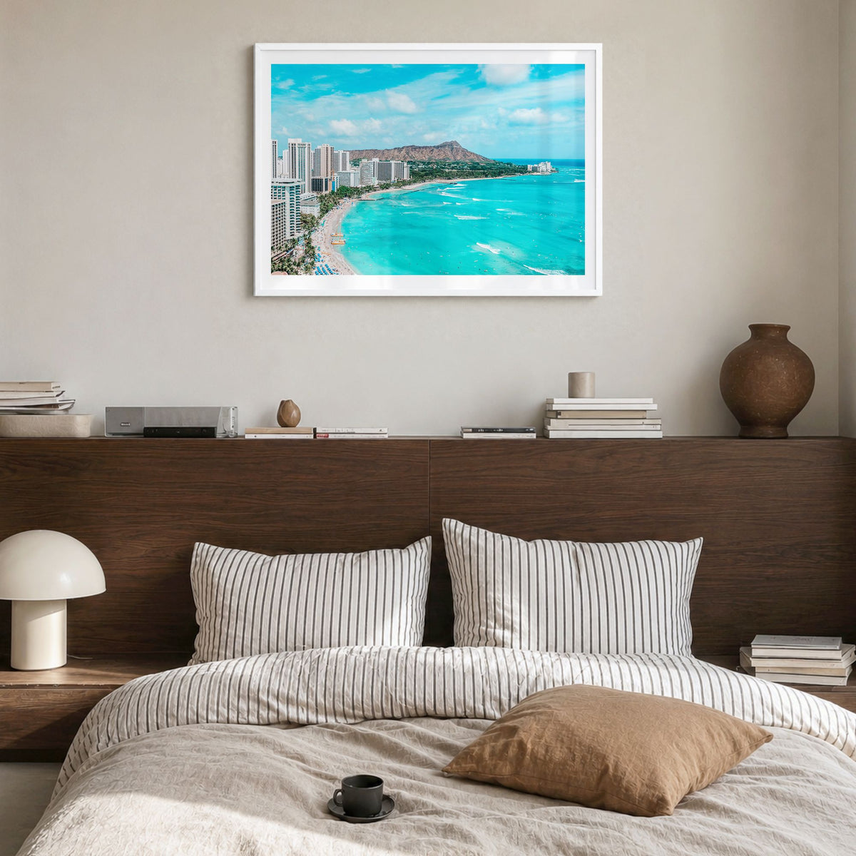 Honolulu Photo Poster in a white wood frame, hanging in a bedroom, white border
