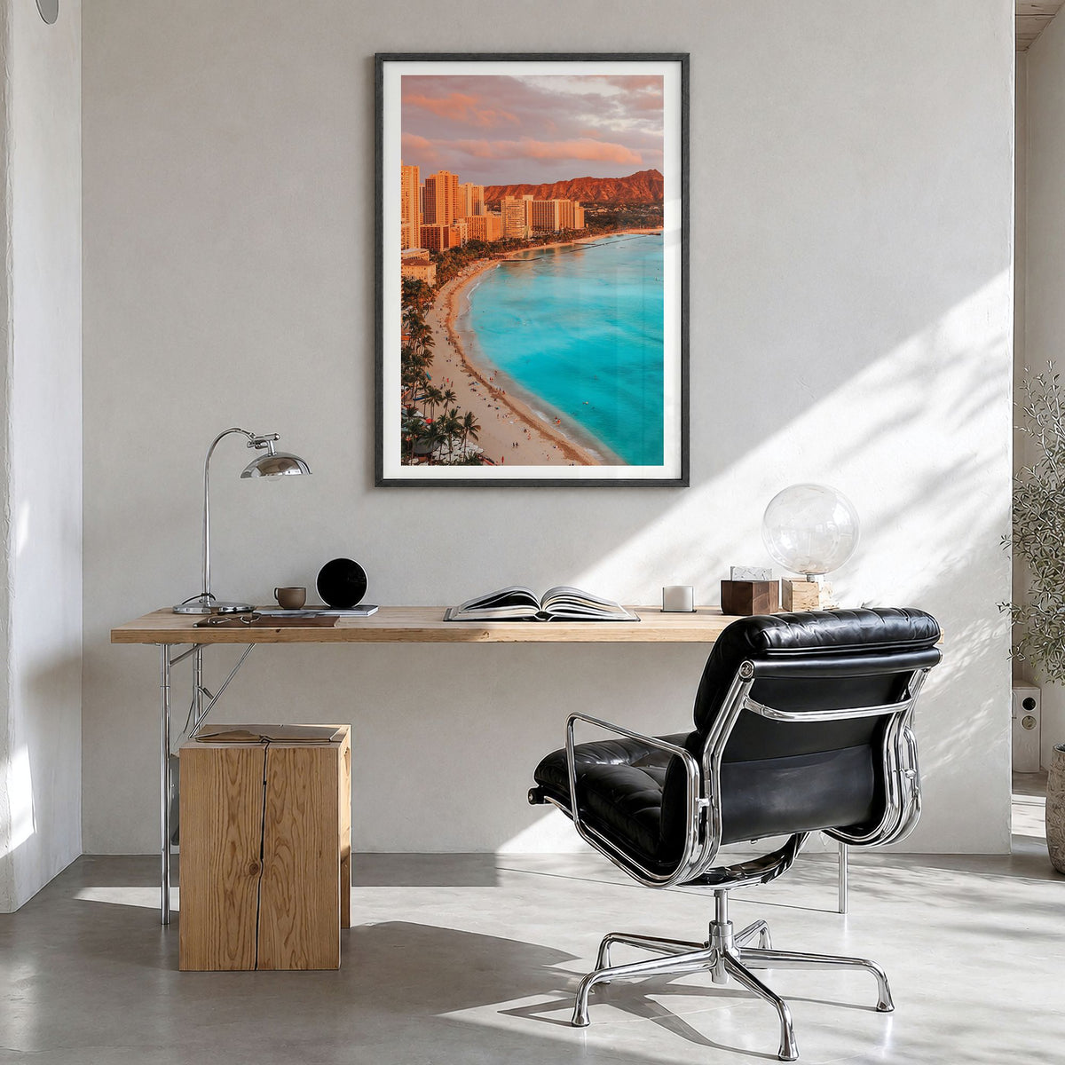 Honolulu Photo Poster in a black wood frame, hanging in a bright home office, white border