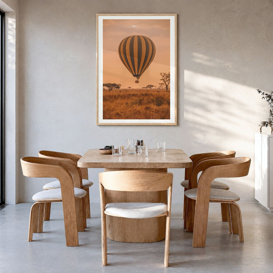 Hot Air Balloon Photo No 1 Poster in a natural wood frame, hanging in a dining room, white border